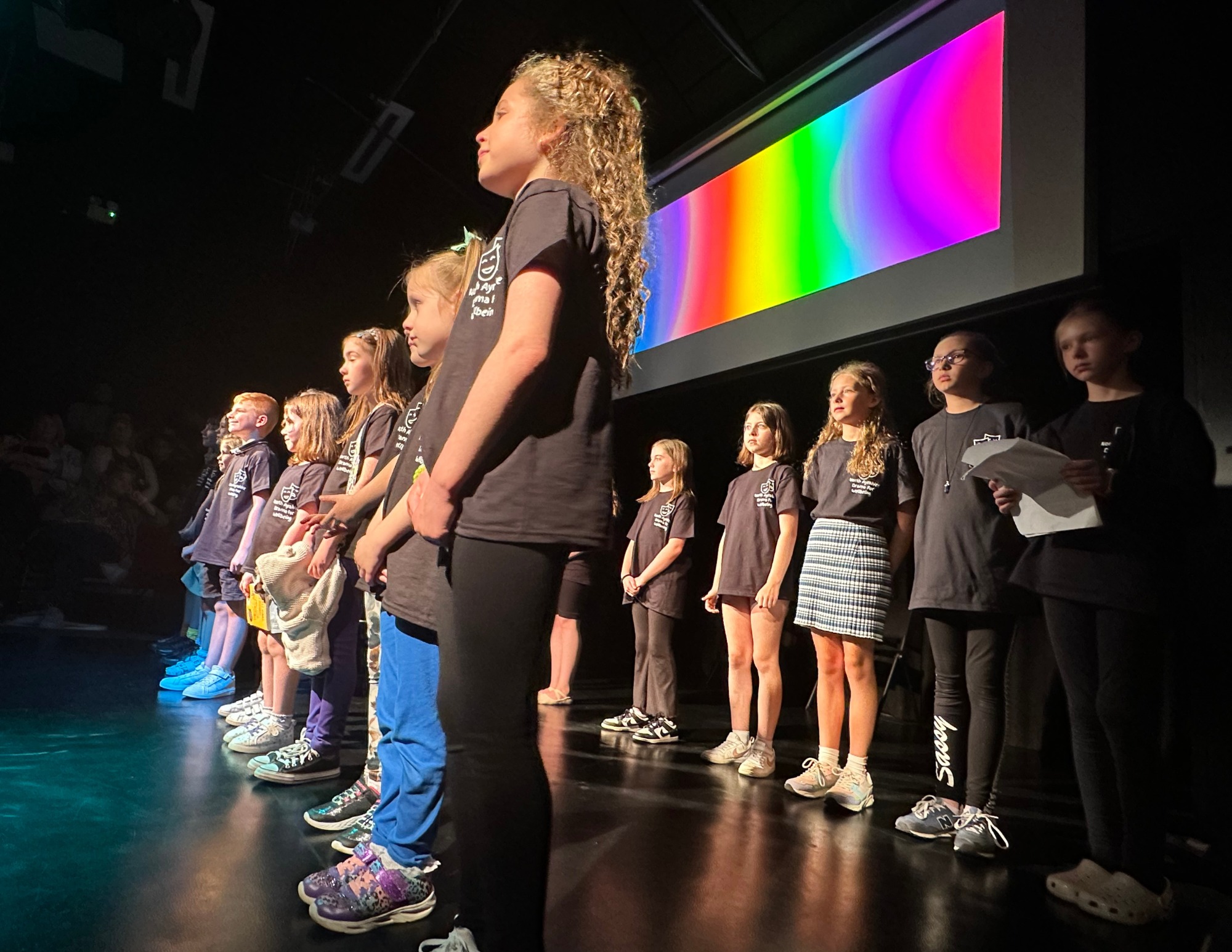 Children and young people on stage to perform a drama show at the Harbour Arts Centre