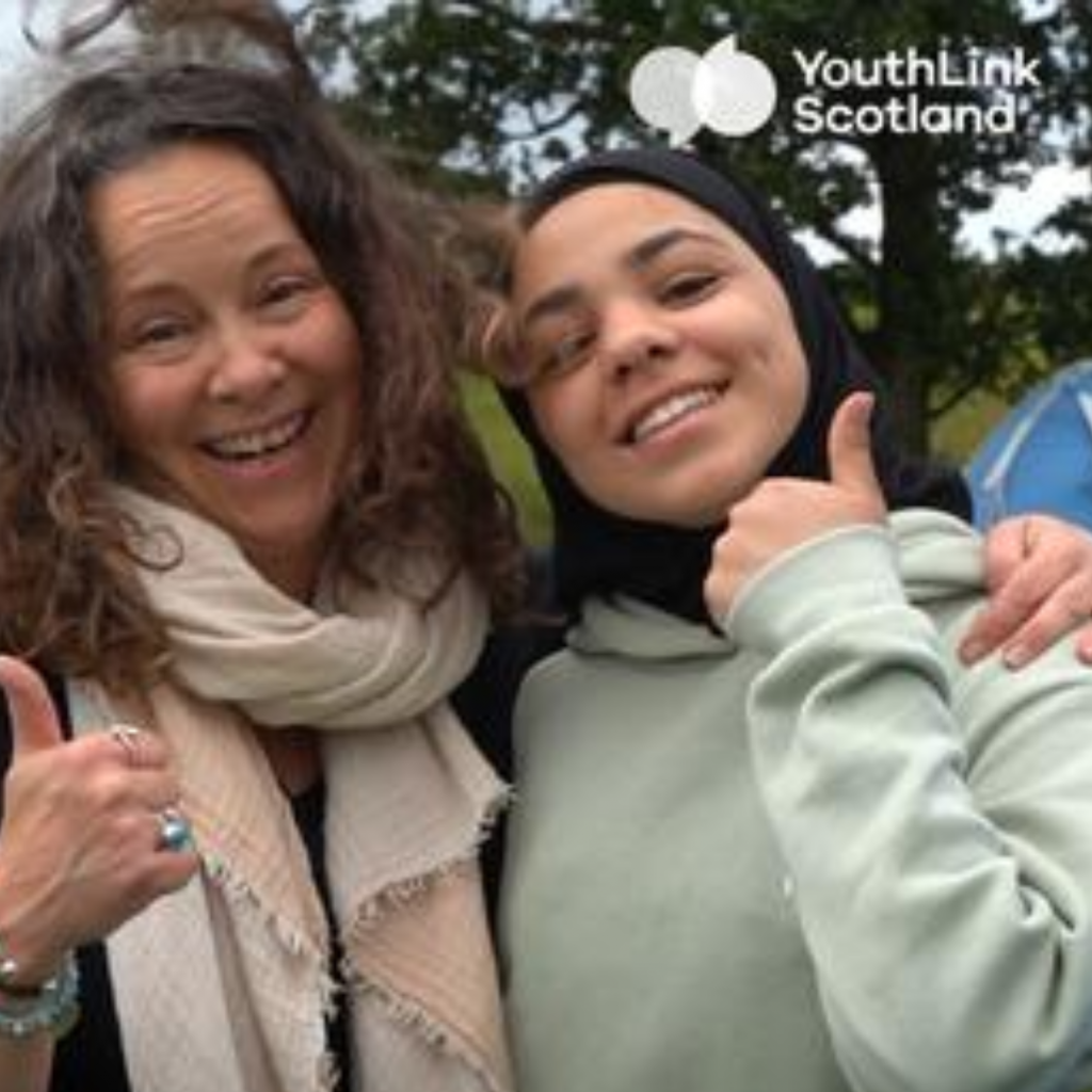 Lady and young person thumbs up for Youth Work Week