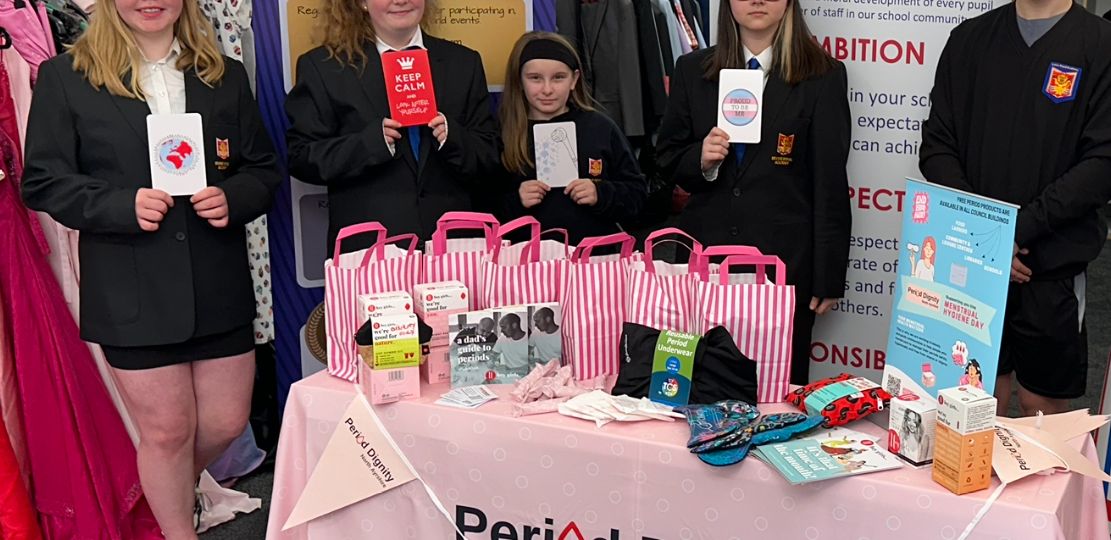 Five pupils promote the Council's free period products provision at the Royal Resources hub