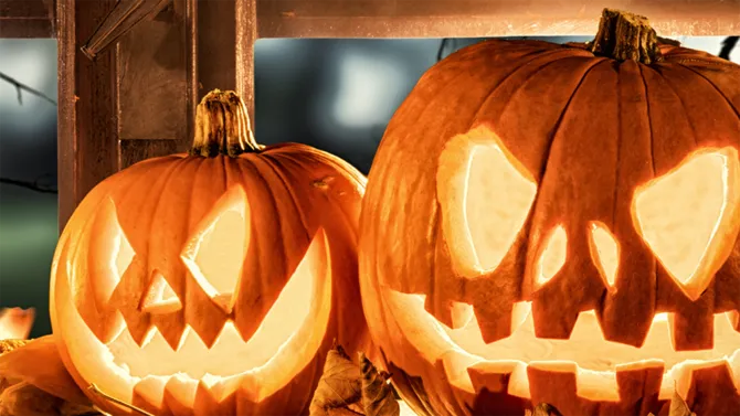 Pumpkins carved with grinning faces