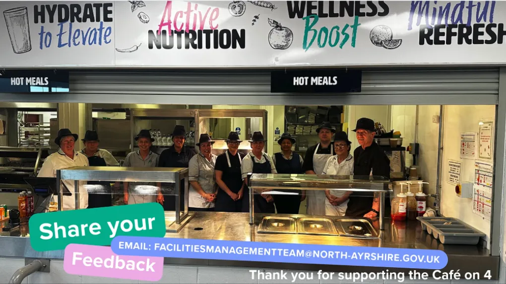 Group photo of Greenwood Production kitchen with share your feedback and thanks for supporting Cafe on 4 message full details in article