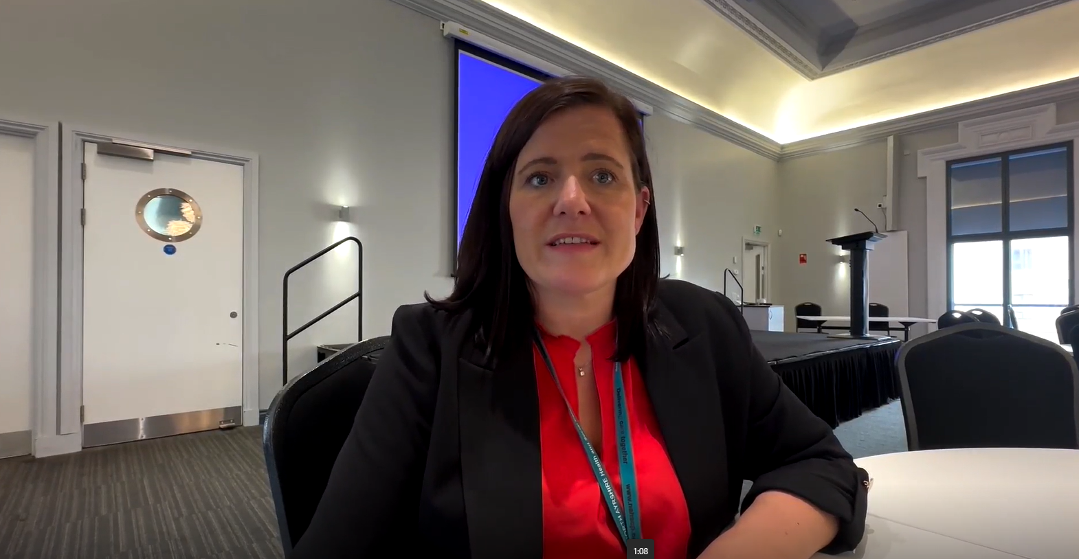 Caroline Cameron sitting at a desk